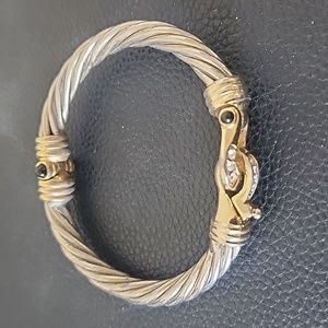 Beautiful silver and gold bracelet with embellishments and rhinestones.